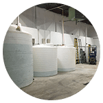 Large water tanks stored inside a warehouse