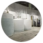 Large water tanks stored inside a warehouse